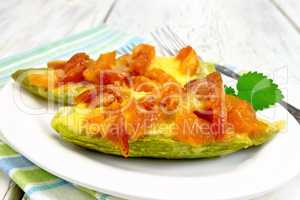Courgettes in spicy sauce with dried apricots on towel