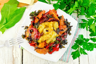 Courgettes with vegetables in plate on napkin top