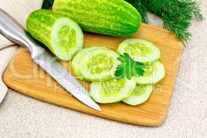 Cucumber with parsley on granite table
