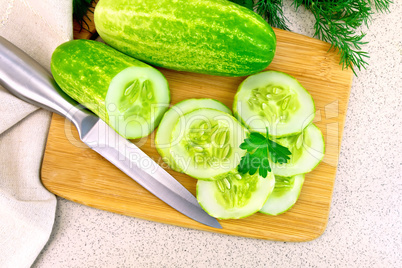 Cucumber with parsley on table top