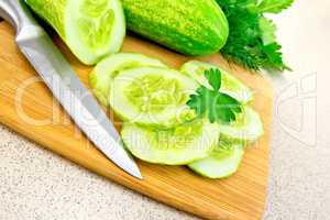 Cucumber with parsley on table