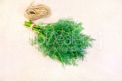 Dill with twine on granite table top