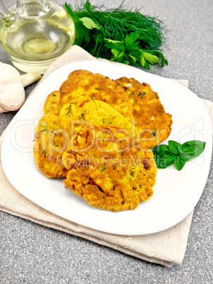 Flapjack chickpeas with zucchini in plate on stone table