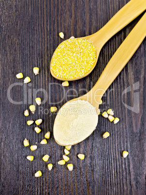 Flour and cereals corn in spoon on dark board top