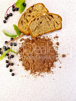Flour bird cherry with fruitcake on table