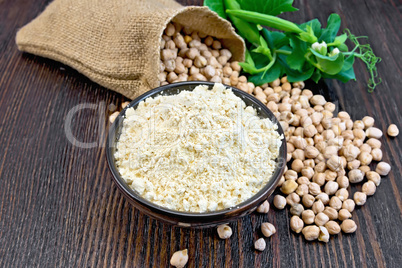 Flour chickpeas in bowl with peas on board