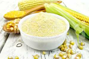 Flour corn in bowl on board