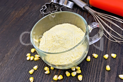 Flour corn in glass cup on board