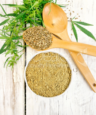 Flour hemp in bowl with spoons on light board top