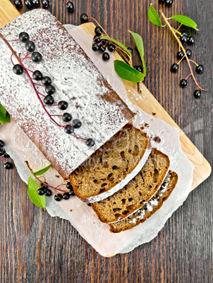 Fruitcake bird cherry cut on board top