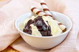 Ice cream vanilla with wafer rolls on napkin