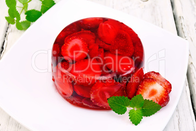 Jelly strawberry with mint on board