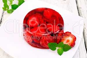 Jelly strawberry with mint on board