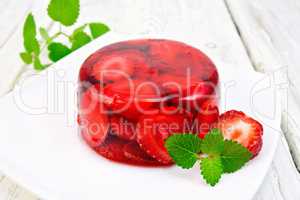 Jelly strawberry with mint on light board