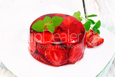 Jelly strawberry with mint on napkin and board