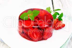 Jelly strawberry with mint on napkin and board