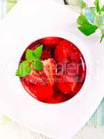 Jelly strawberry with mint on table top
