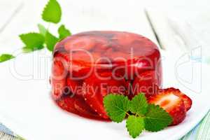 Jelly strawberry with mint on table