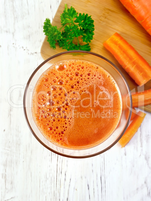 Juice carrot with vegetables on board top