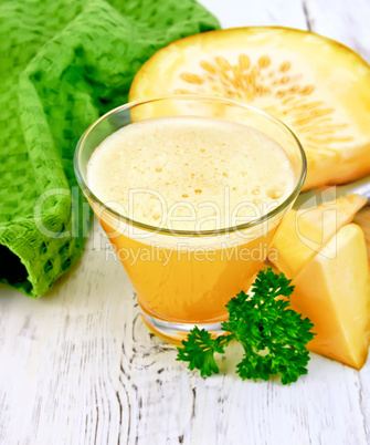 Juice pumpkin with napkin and parsley on board