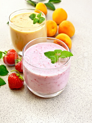 Milkshake strawberry and apricot on granite table