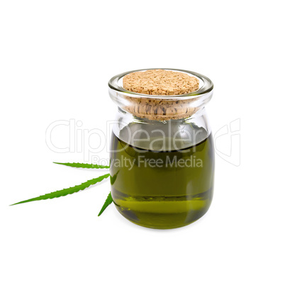 Oil hemp in glass jar with leaf