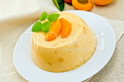 Panna cotta apricot with mint on napkin