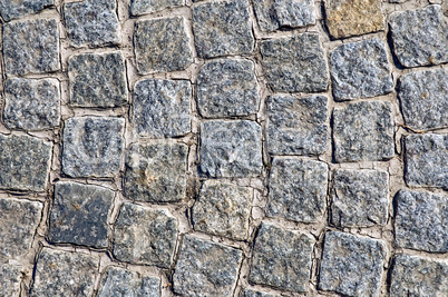 Pavement of granite square tiles