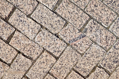 Pavement of granite tiles at an angle