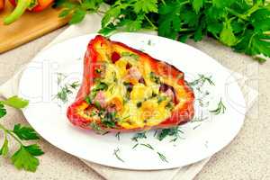 Pepper stuffed with sausage and cheese in plate