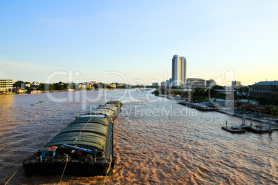 Floating ships on the Chao Phraya River in Bangkok. Thailand