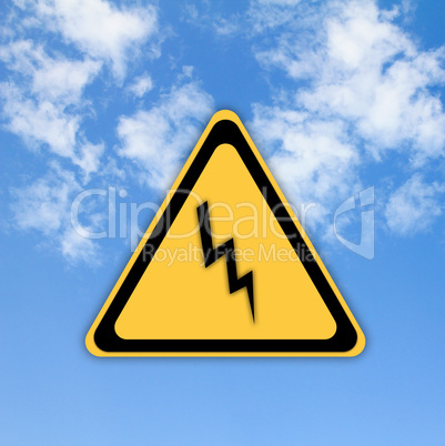 Danger high voltage sign on beautiful sky background.