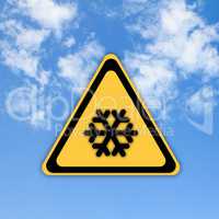 Snow warning sign on beautiful sky background.