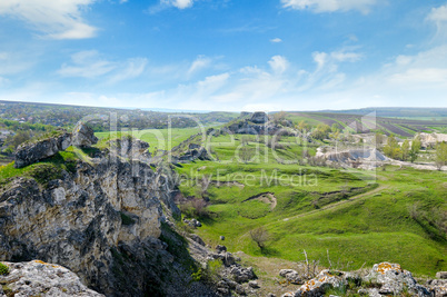 Deposits of limestone, quarry, green hills and rural landscape