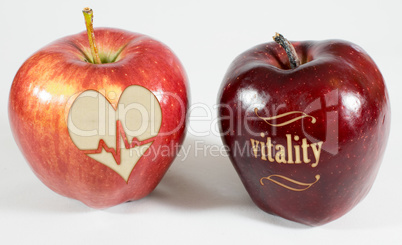 1 Apfel mit der Aufschrift vitality und ein Apfel mit einem Herz