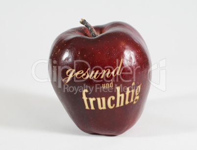 Roter Apfel mit der Aufschrift gesund und fruchtig