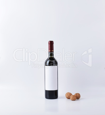 Mockup wine bottle with three nuts isolated