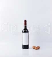 Mockup wine bottle with three nuts isolated