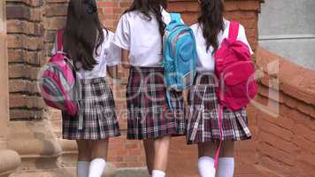 School Girls Walking With Backpacks