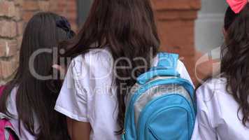 Female Teen Students With Backpacks
