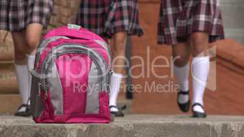 Pink School Backpack And Girls Wearing Skirts