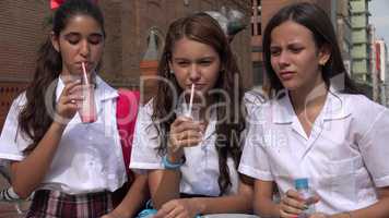 Young Girls Drinking Juice And Water