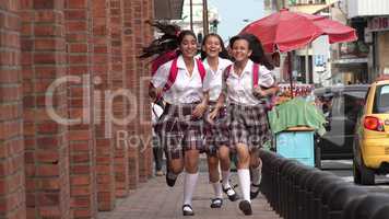 Teen Girls Running On Sidewalk