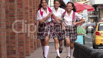 Teen Girls Running On Sidewalk