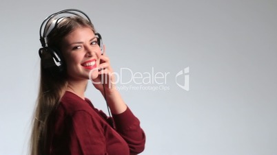 Party woman with headphones listening to music.