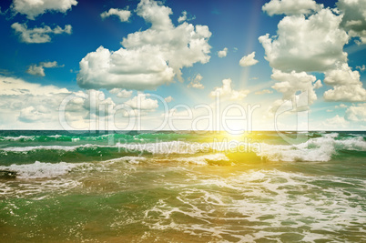 ocean, sandy beach, blue sky and sunrise