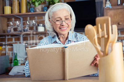 Senior woman with cookbook