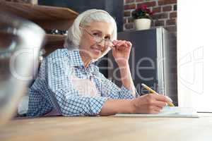 Senior woman with cookbook