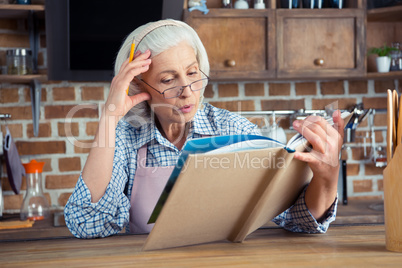 Senior woman with cookbook