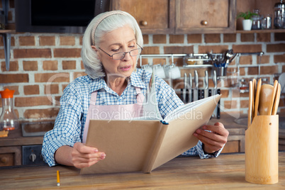 Senior woman with cookbook